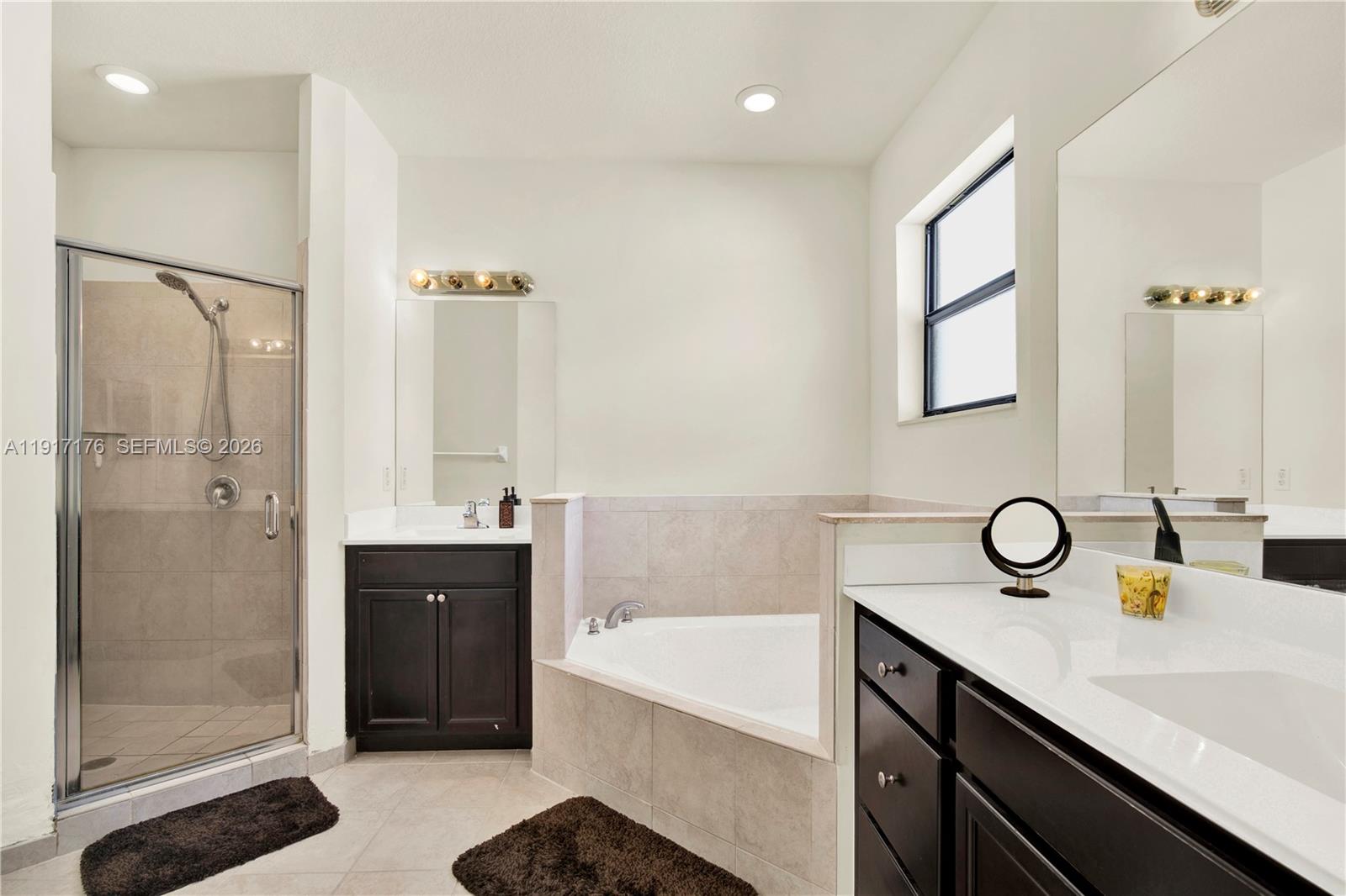 217 Northeast 23rd Terrace Homestead, FL 33033 - Photo 23 of 59 a bathroom with a tub sink shower and mirror