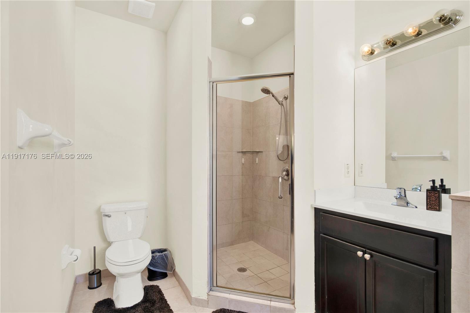 217 Northeast 23rd Terrace Homestead, FL 33033 - Photo 24 of 59 a bathroom with a sink a toilet and shower