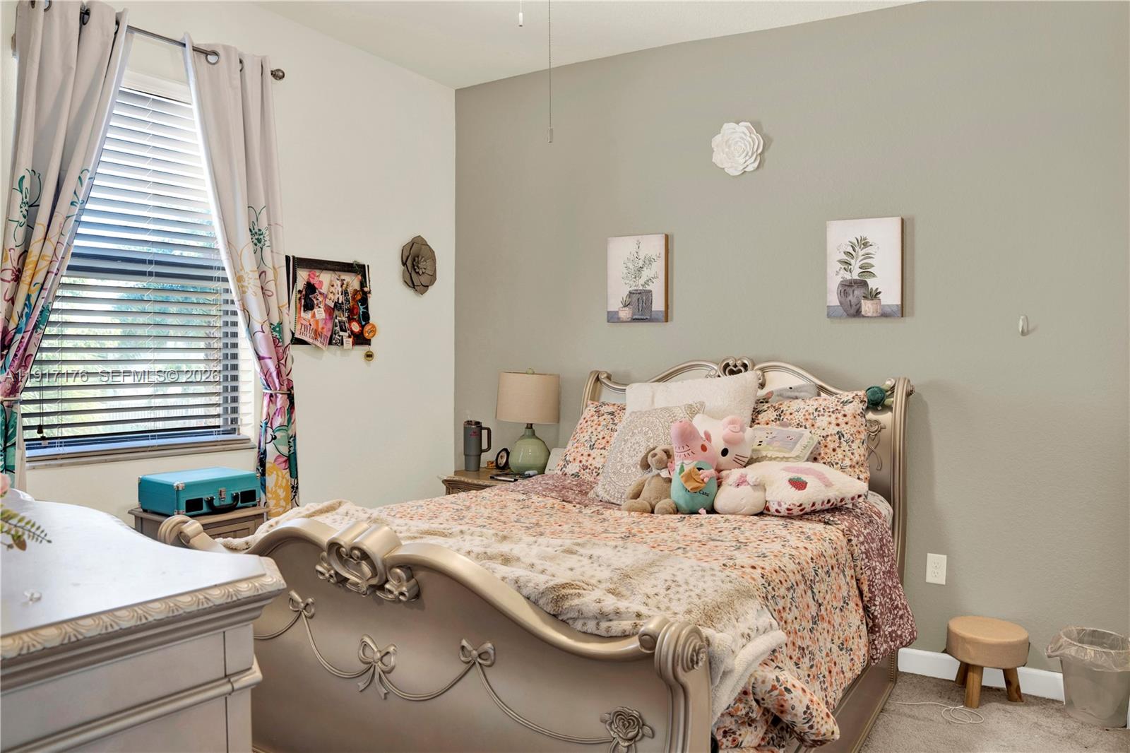 217 Northeast 23rd Terrace Homestead, FL 33033 - Photo 26 of 59 a bedroom with a bed and a table