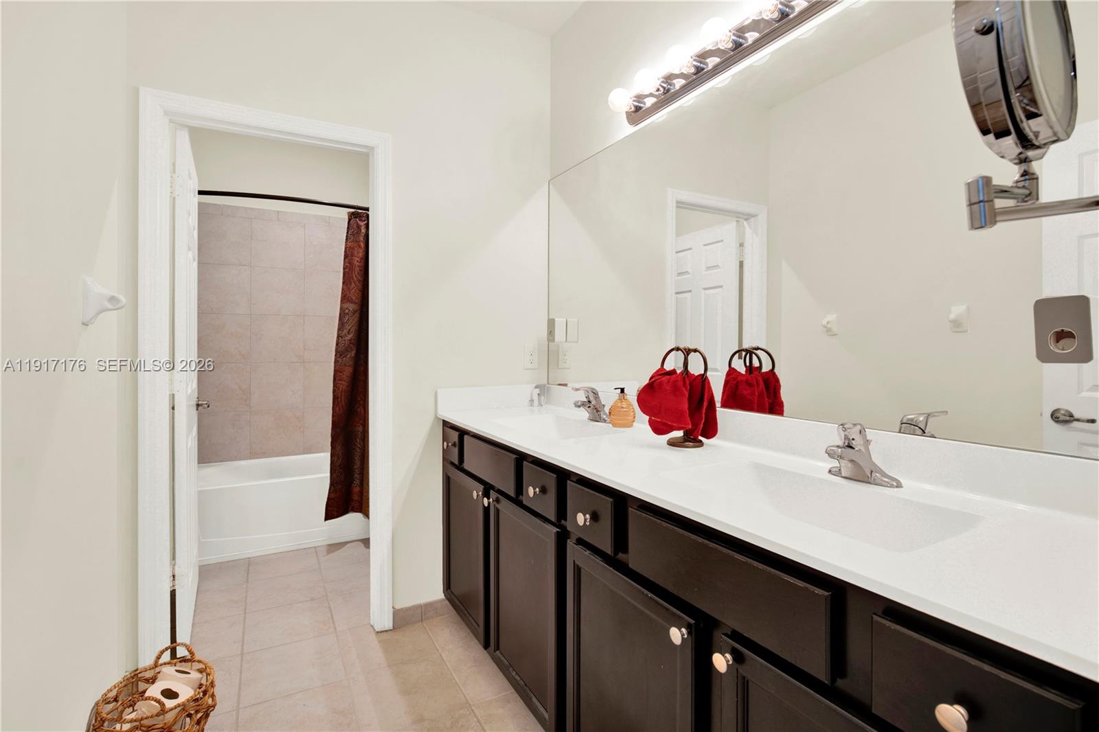 217 Northeast 23rd Terrace Homestead, FL 33033 - Photo 29 of 59 a bathroom with a sink and a mirror