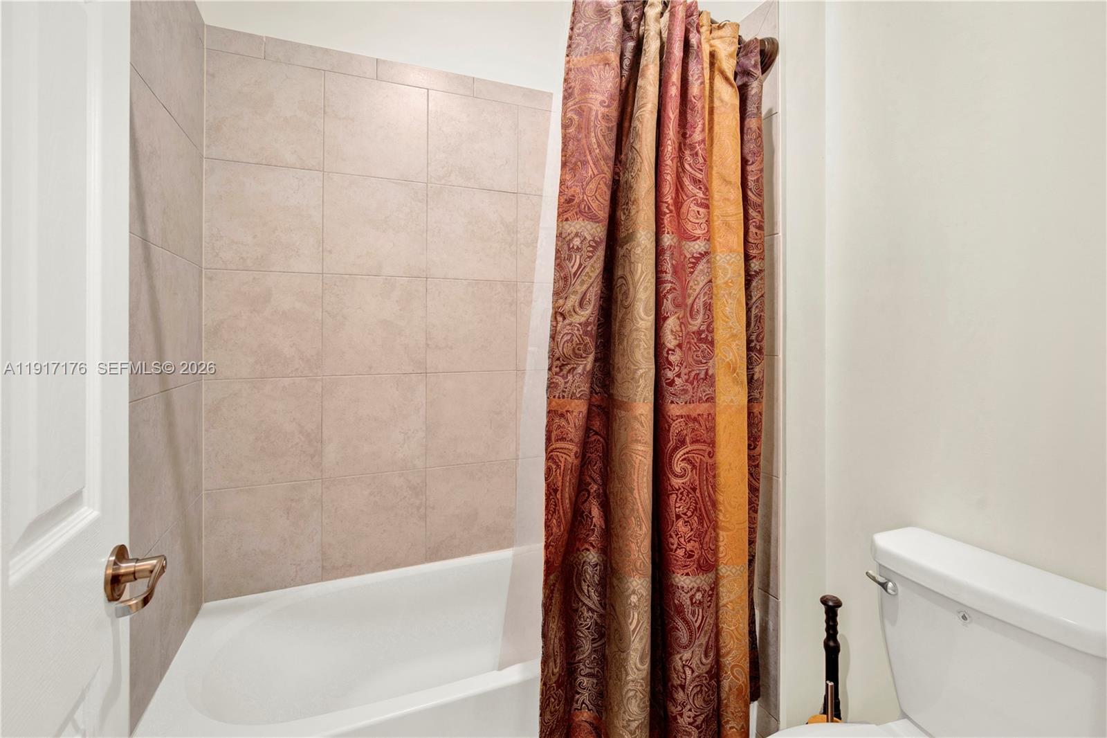 217 Northeast 23rd Terrace Homestead, FL 33033 - Photo 30 of 59 a bathroom with a shower and a toilet