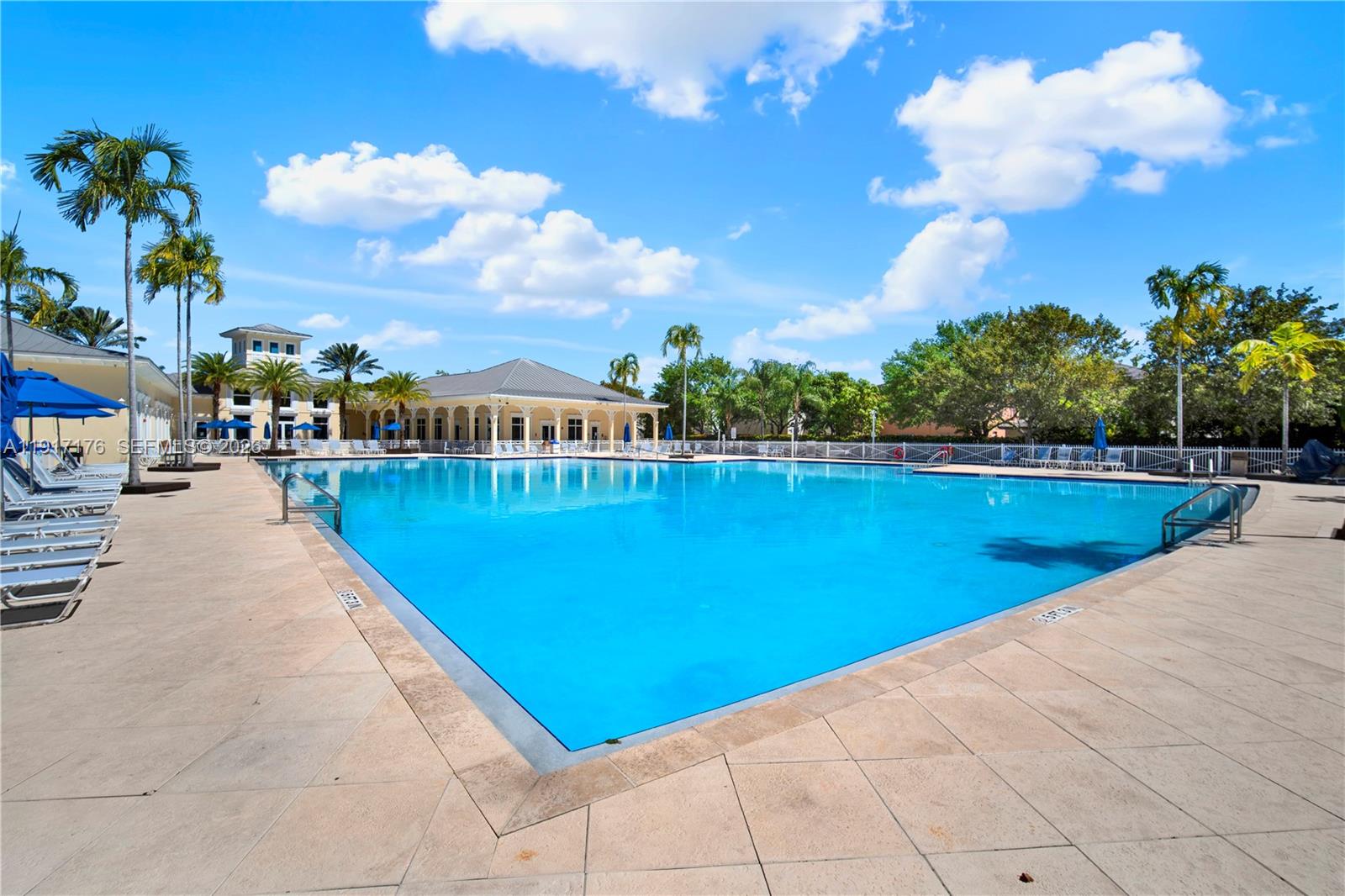 217 Northeast 23rd Terrace Homestead, FL 33033 - Photo 45 of 59 a view of a swimming pool and lounge chair