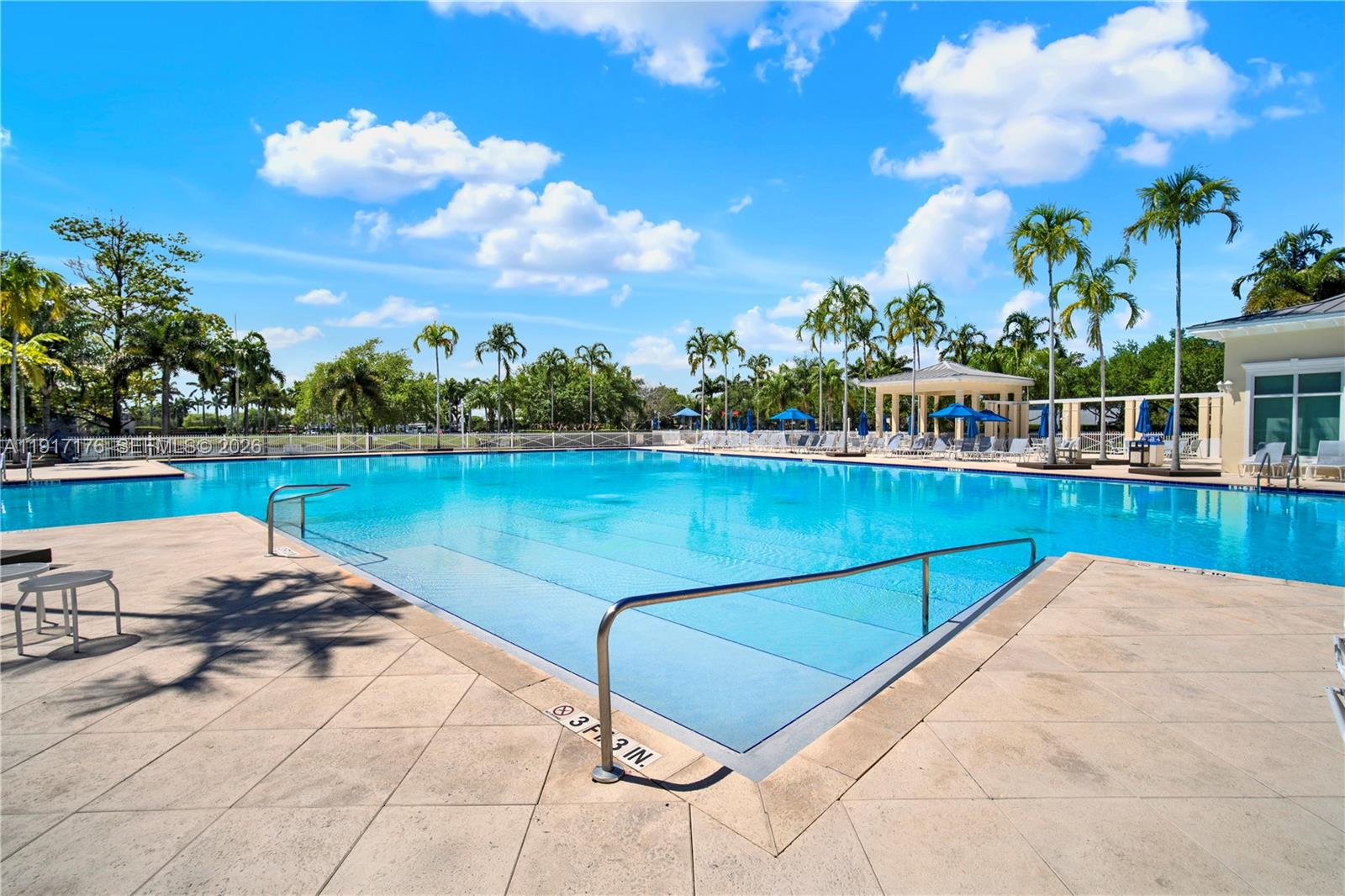 217 Northeast 23rd Terrace Homestead, FL 33033 - Photo 47 of 59 a view of a swimming pool and lounge chairs