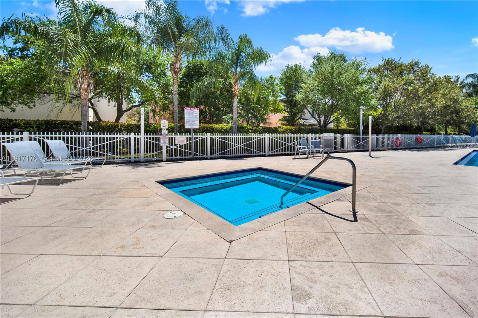 217 Northeast 23rd Terrace Homestead, FL 33033 - Photo 48 of 59 a swimming pool with trees in the background