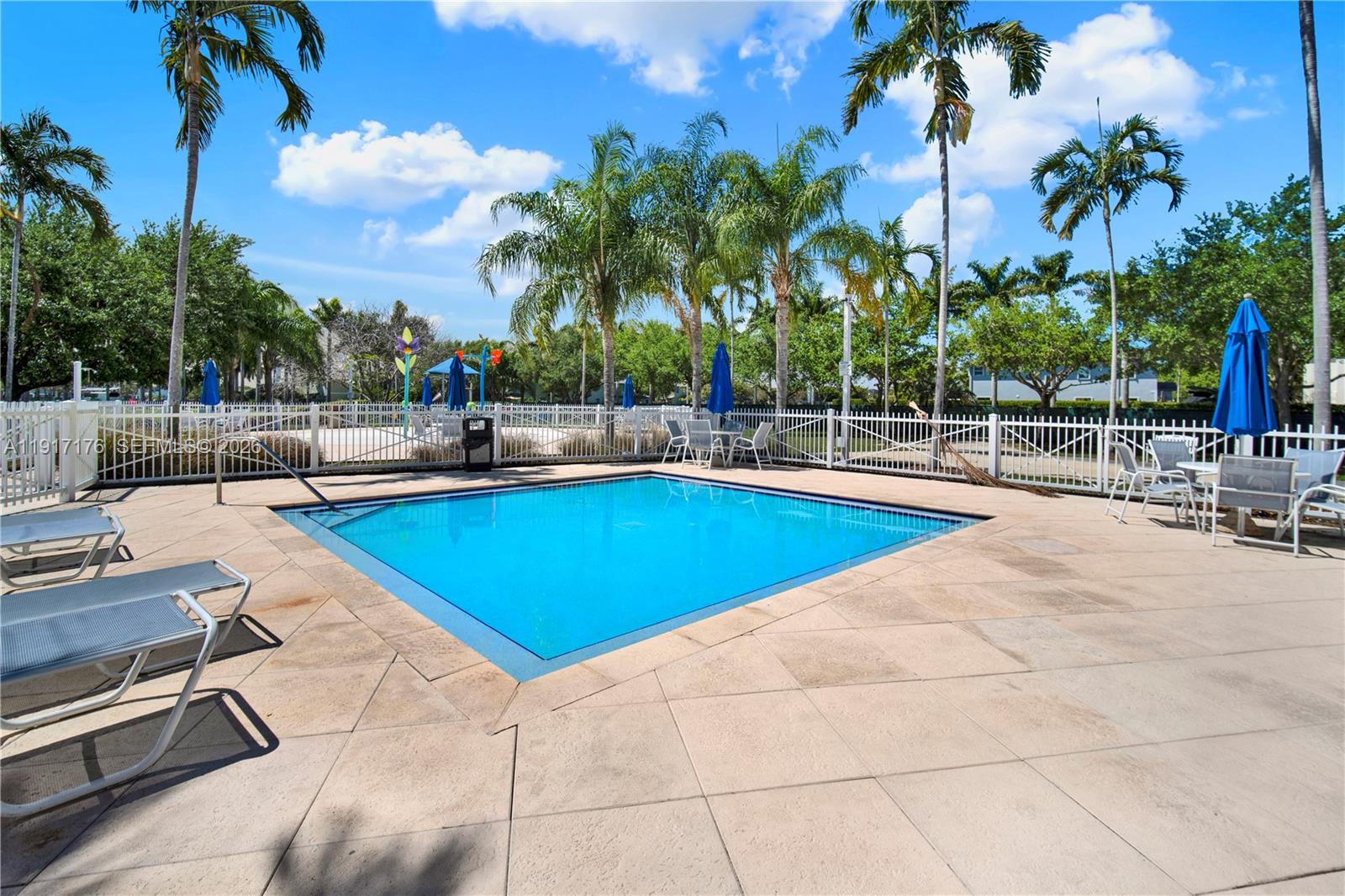 217 Northeast 23rd Terrace Homestead, FL 33033 - Photo 49 of 59 a swimming pool with outdoor seating and yard