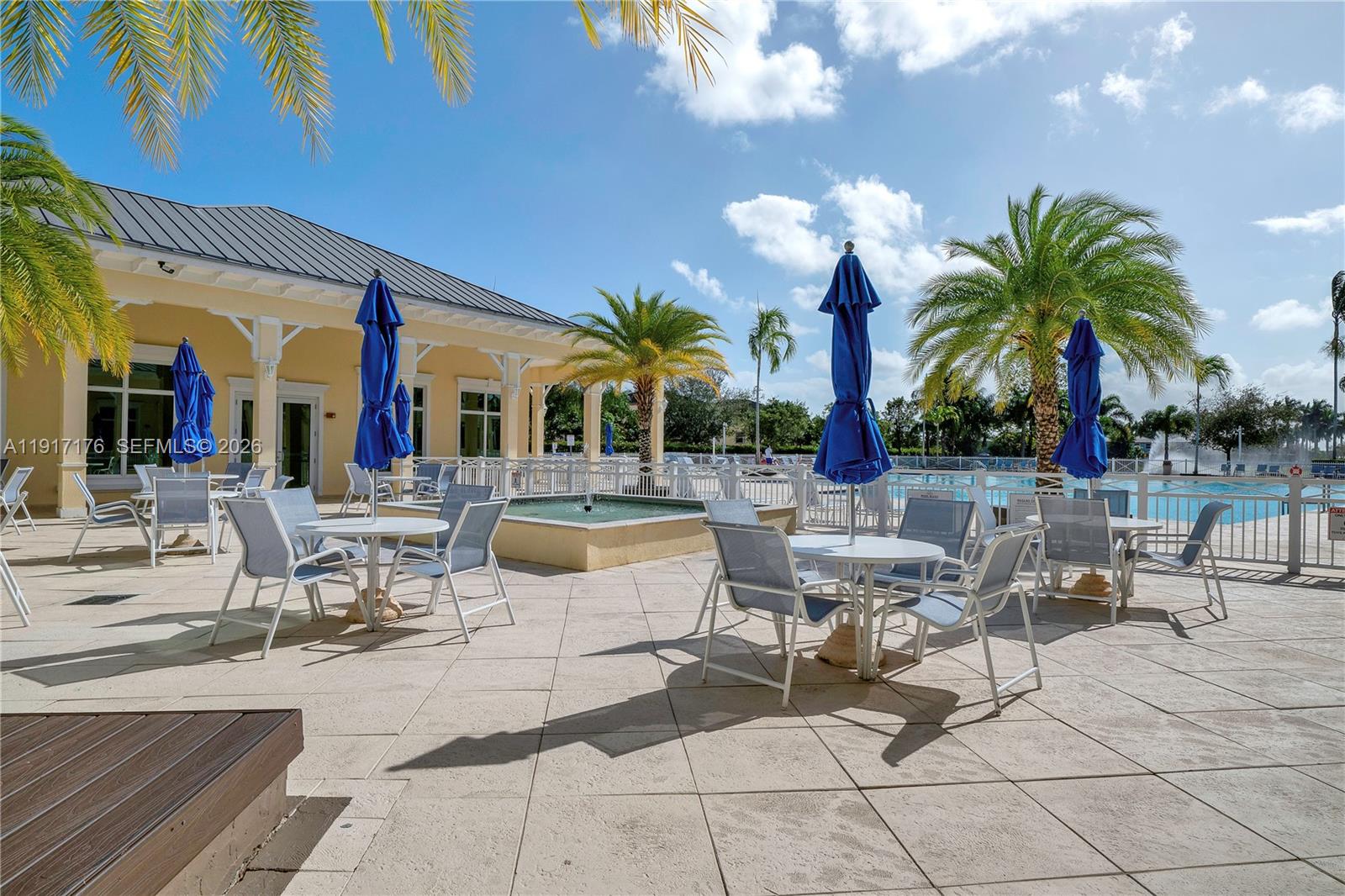 217 Northeast 23rd Terrace Homestead, FL 33033 - Photo 51 of 59 a view of a patio with dining table and chairs with plants