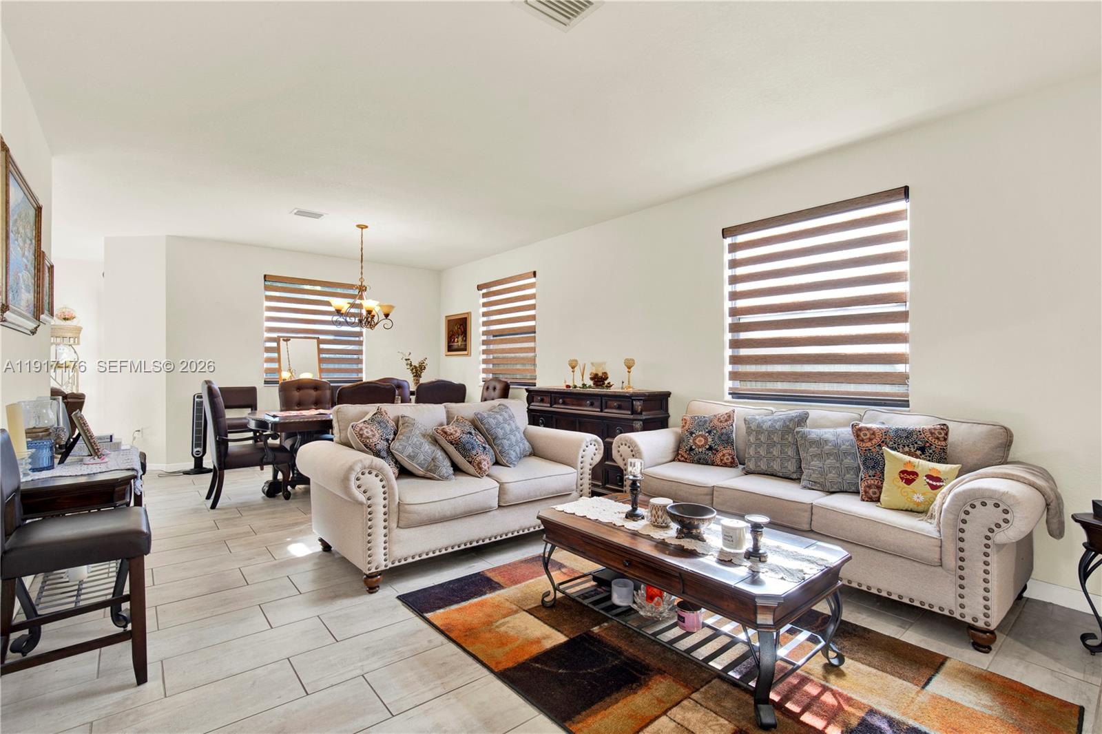 217 Northeast 23rd Terrace Homestead, FL 33033 - Photo 7 of 59 a living room with furniture and a large window