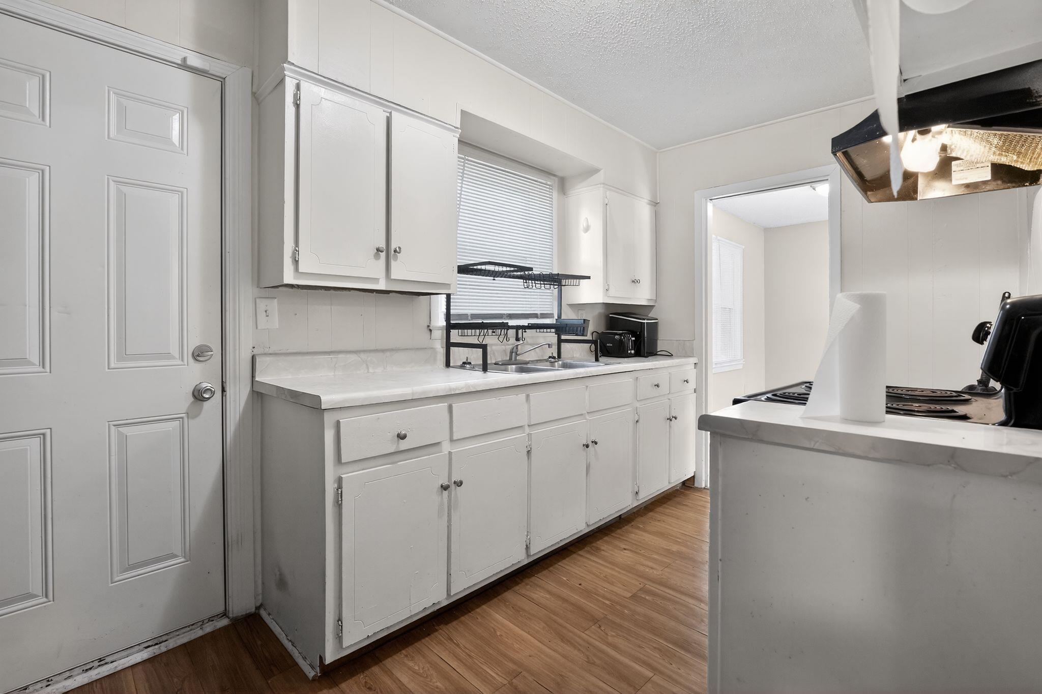 2144 St Elmo Avenue Memphis, TN 38127 - Photo 11 of 31 a kitchen with stainless steel appliances granite countertop a sink a stove and cabinets
