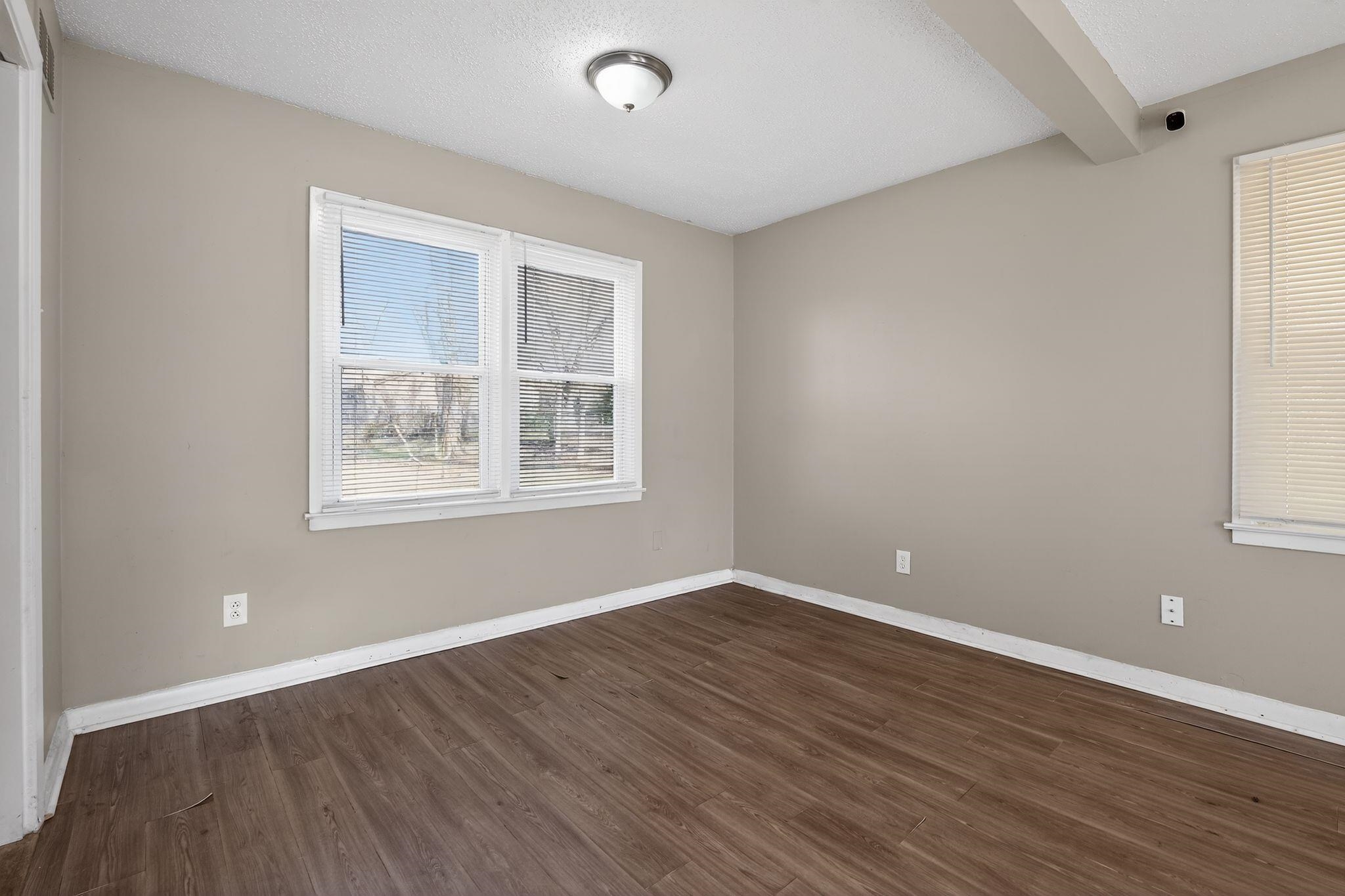 2144 St Elmo Avenue Memphis, TN 38127 - Photo 15 of 31 a view of empty room with wooden floor and fan