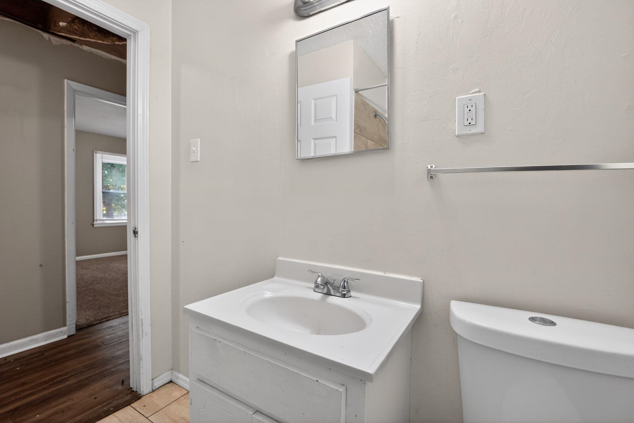 2144 St Elmo Avenue Memphis, TN 38127 - Photo 20 of 31 a bathroom with a sink a toilet and a mirror