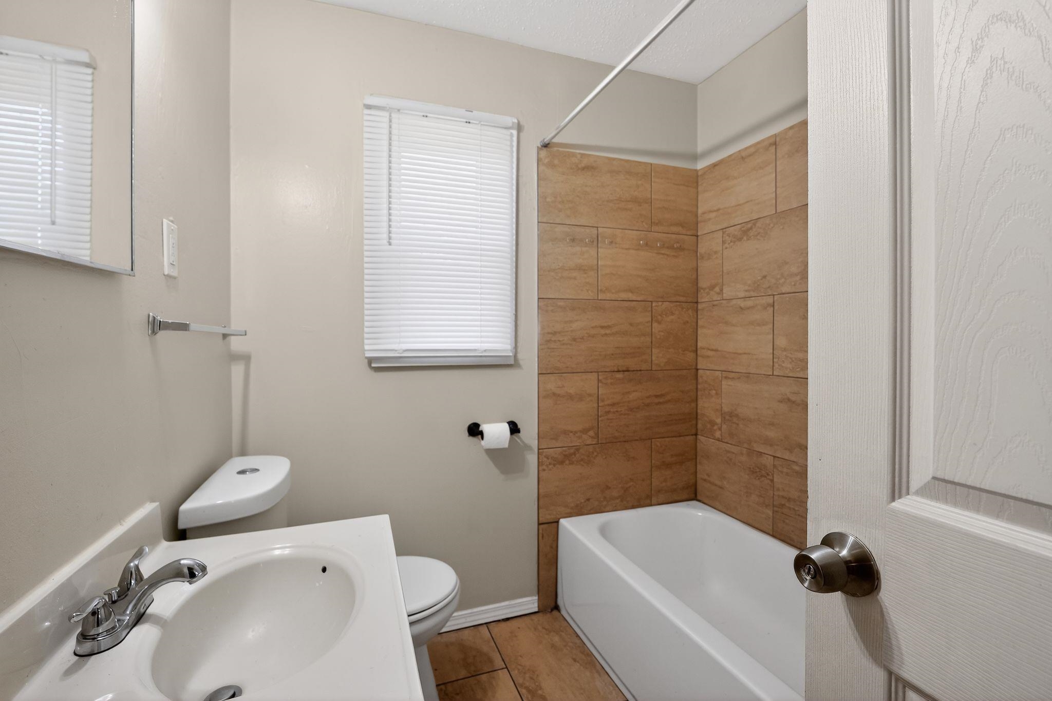 2144 St Elmo Avenue Memphis, TN 38127 - Photo 21 of 31 a bathroom with a sink toilet and shower