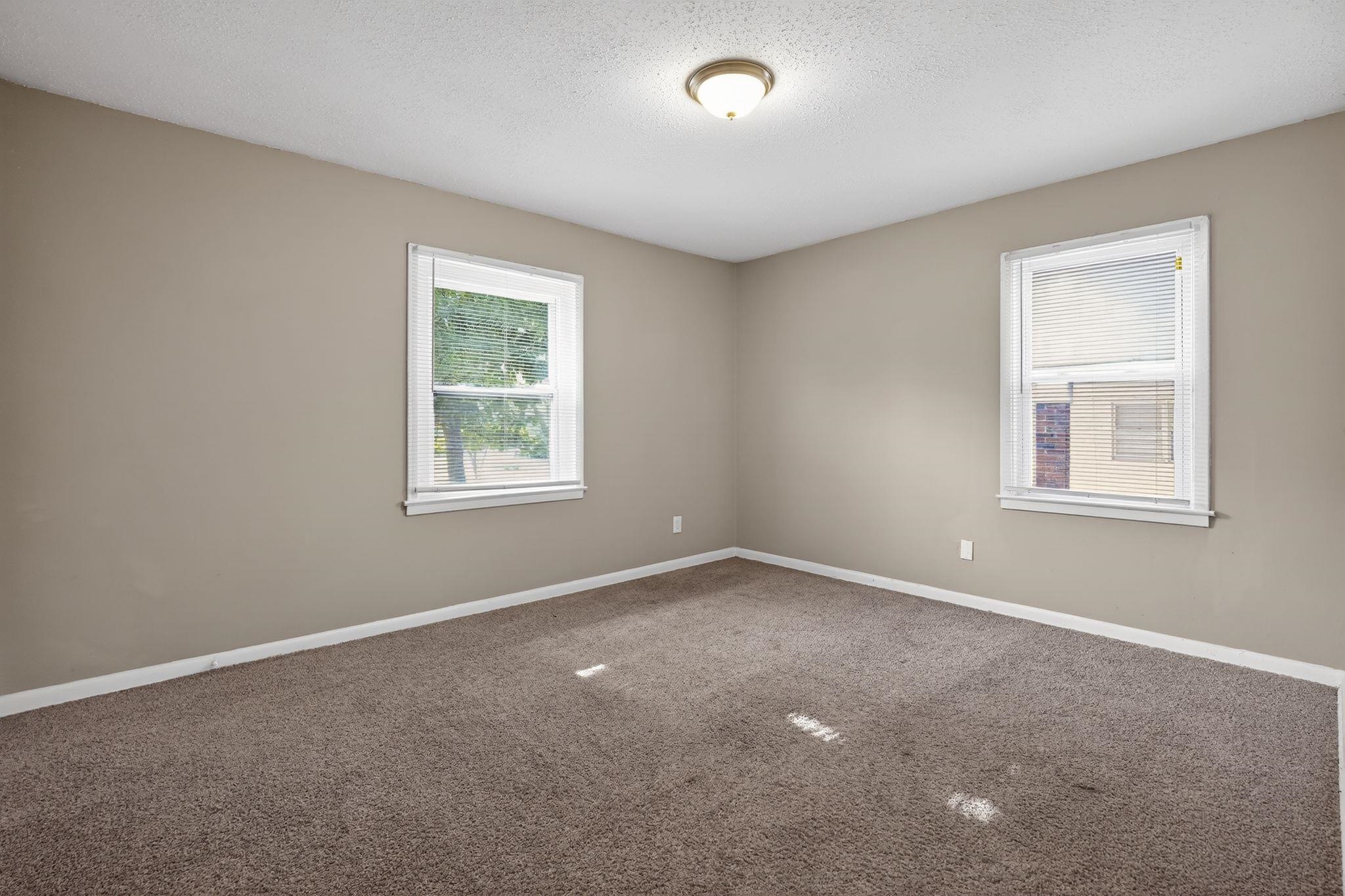 2144 St Elmo Avenue Memphis, TN 38127 - Photo 7 of 31 an empty room with windows