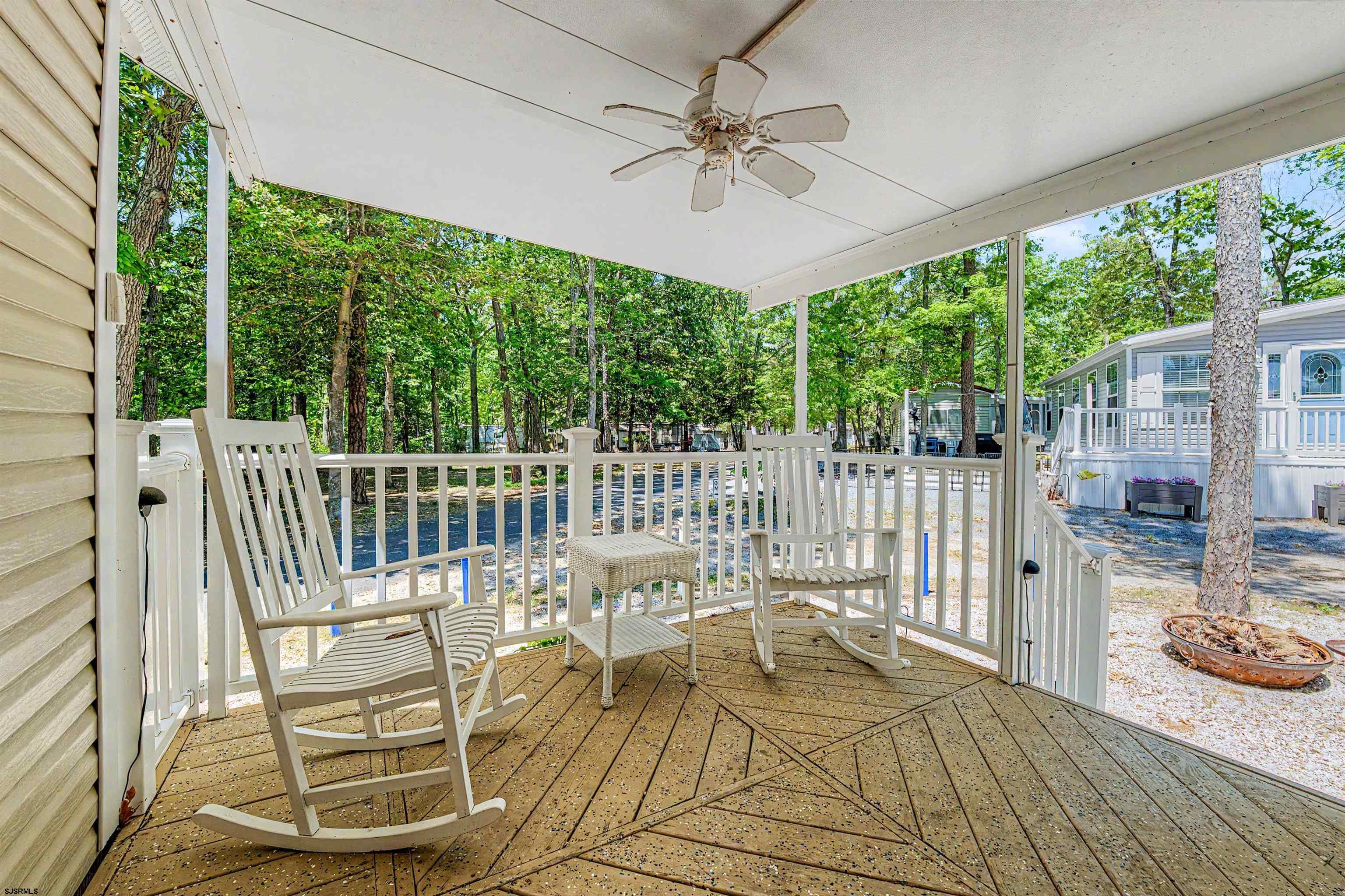 3066 Route 9 Ocean View, NJ 08230 - Photo 7 of 29 a view of a patio with a table chairs and a floor to ceiling window