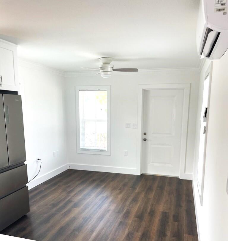 45 Rosin Cup Circle Santa Rosa Beach, FL 32459 - Photo 6 of 10 an empty room with wooden floor and windows