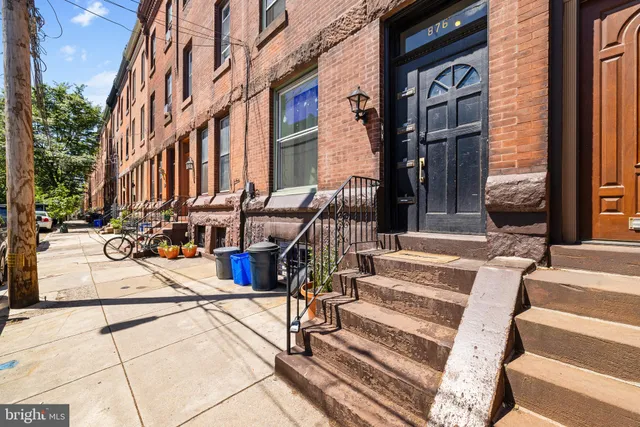 a view of buildings with wooden floor and windows