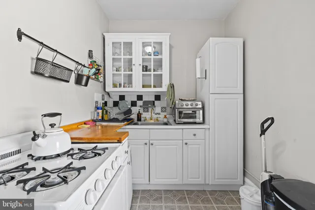 a bathroom with a sink double vanity and a tub