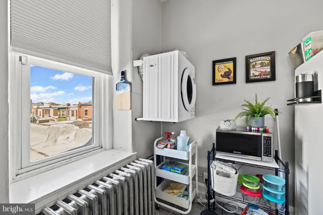 a bedroom with furniture and a window