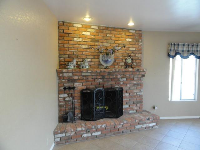 1687 Lone Oak Road Vista, CA 92084 - Photo 16 of 25 Brick fireplace in spacious 24x14 Family room