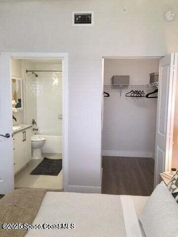 2745 Bosque Circle, Unit 307 Melbourne, FL 32940 - Photo 11 of 18 a bathroom with a sink and a mirror