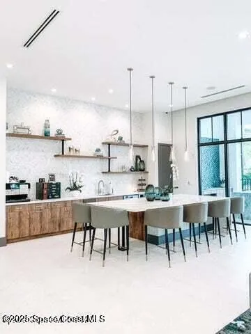 a dining table with chairs and window