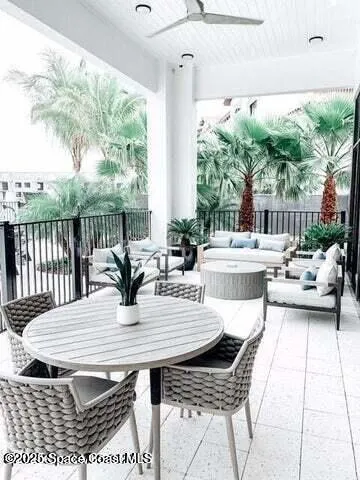 a view of a dining table and chairs in the patio