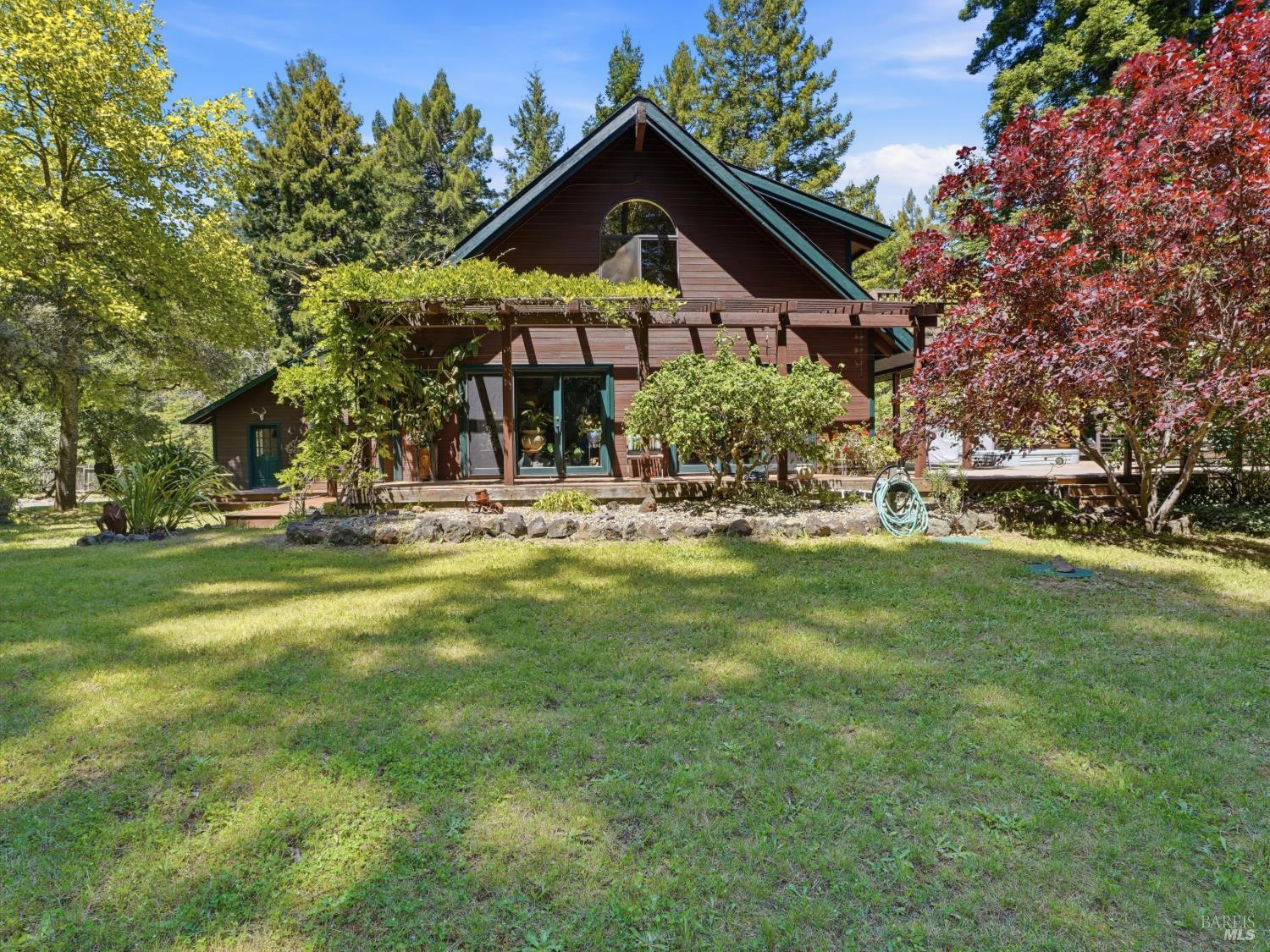 31397 Seaview Road Cazadero, CA 95421 - Photo 1 of 47 a front view of a house with a yard