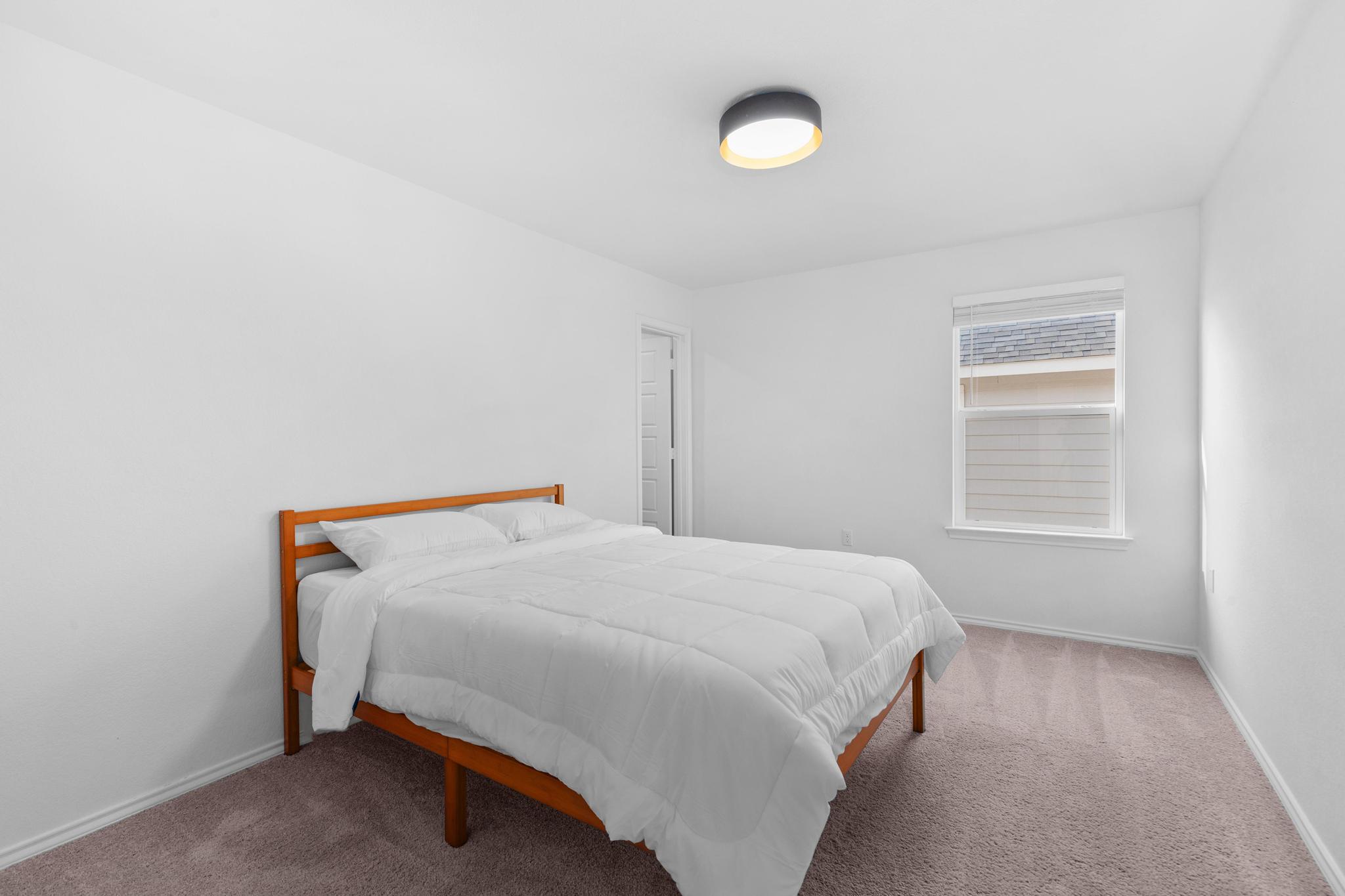 4712 Pear Light Rd Manor Manor, TX 78653 - Photo 23 of 39 Carpeted bedroom featuring baseboards