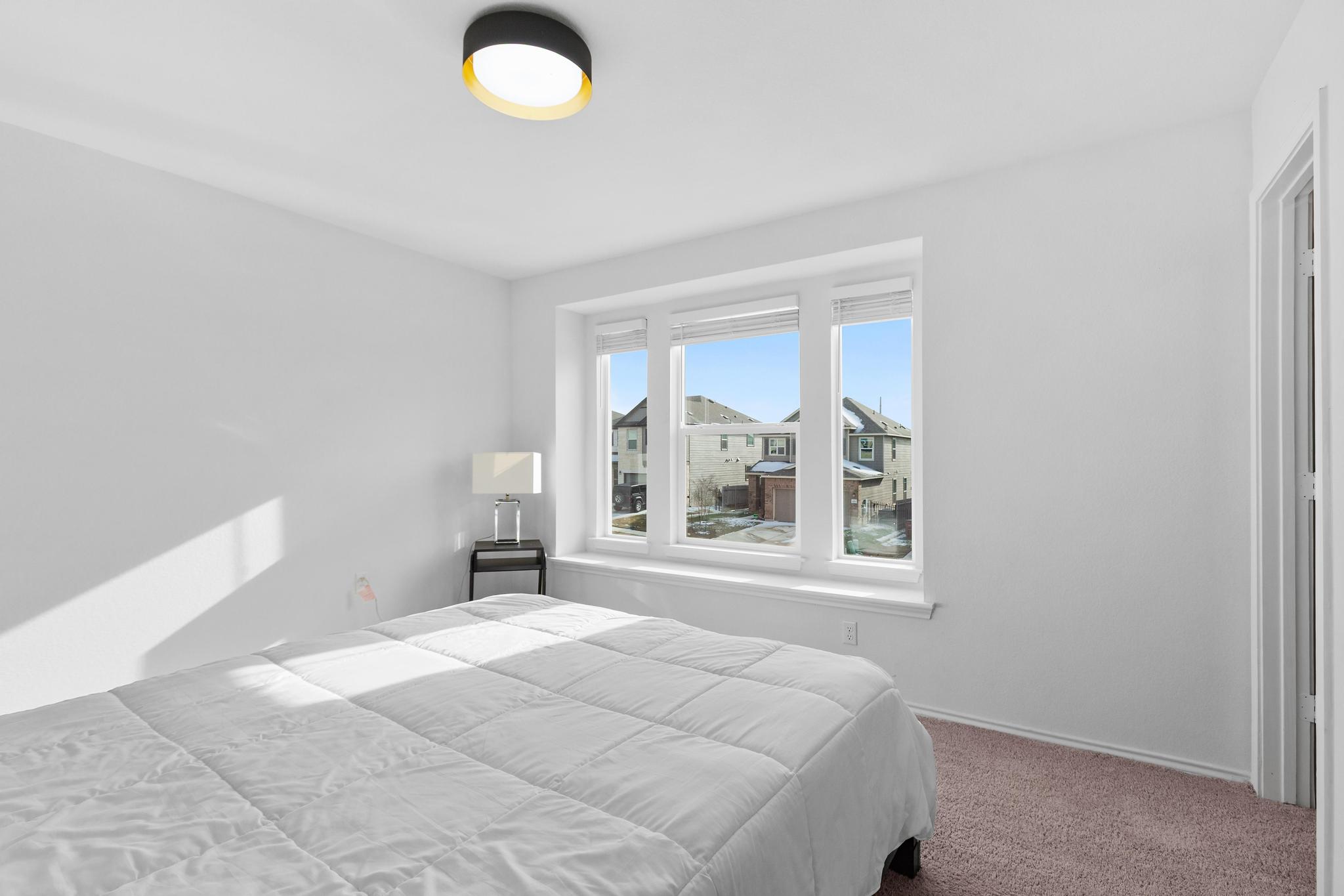 4712 Pear Light Rd Manor Manor, TX 78653 - Photo 26 of 39 Bedroom with carpet floors and baseboards