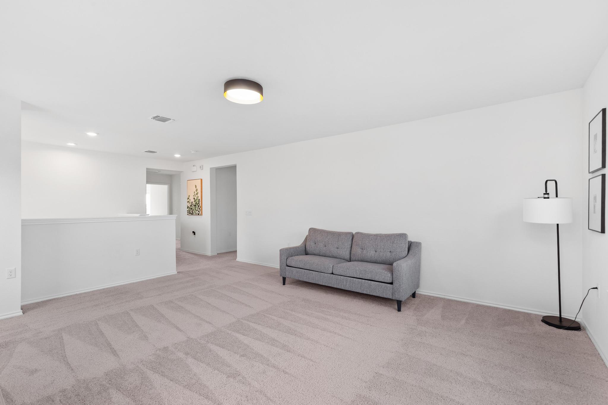 4712 Pear Light Rd Manor Manor, TX 78653 - Photo 28 of 39 Sitting room with light colored carpet and recessed lighting