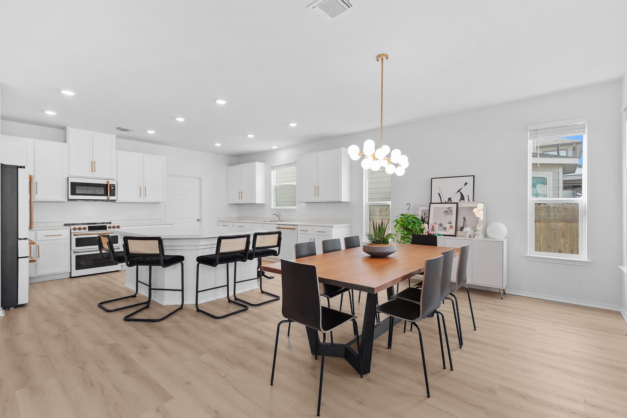 4712 Pear Light Rd Manor Manor, TX 78653 - Photo 9 of 39 Dining area featuring light wood-style flooring, a chandelier, and recessed lighting