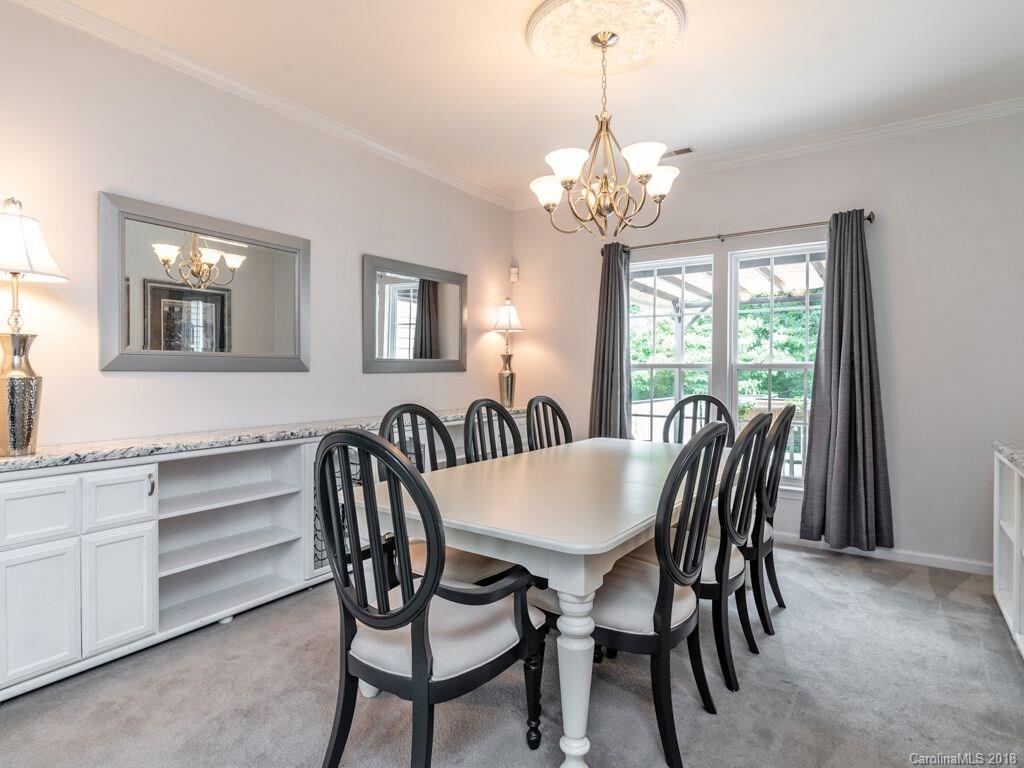 253 Hyde Park Lane Fort Mill, SC 29708 - Photo 12 of 26 a view of a dining room with furniture window and chandelier