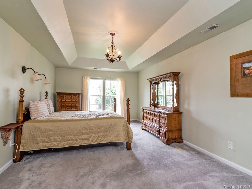 253 Hyde Park Lane Fort Mill, SC 29708 - Photo 14 of 26 a bedroom with a bed and window