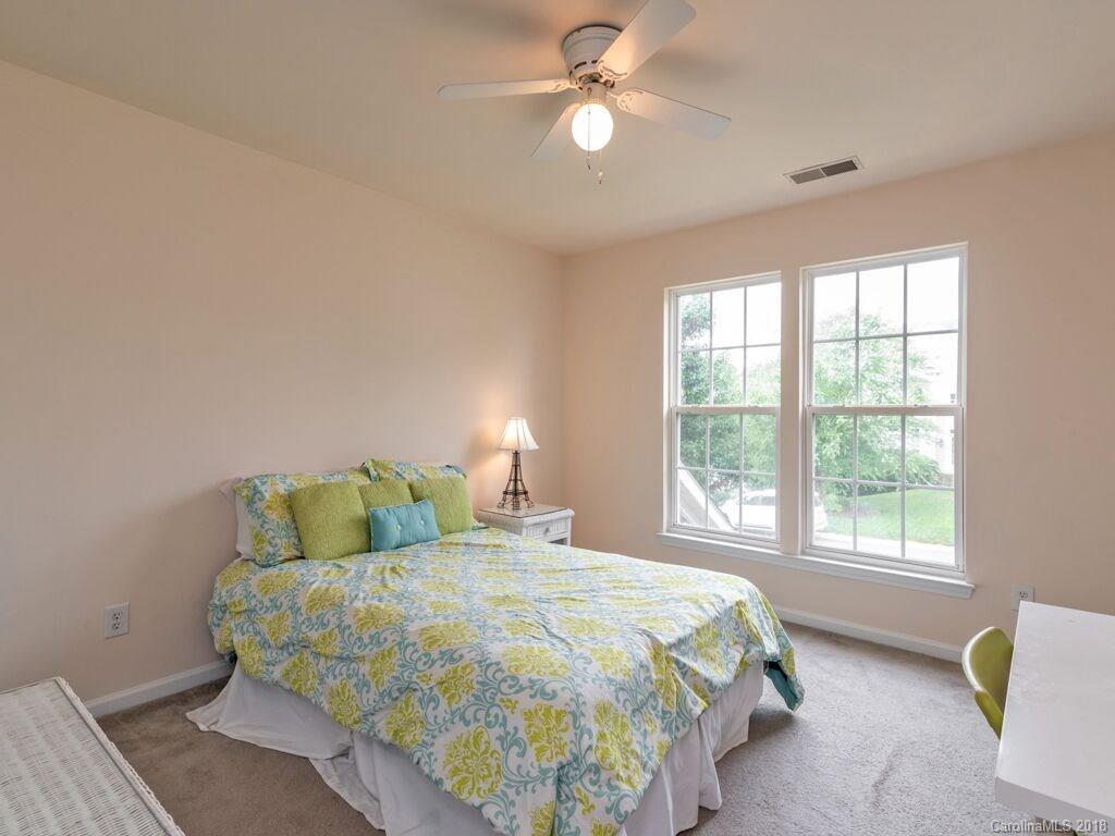 253 Hyde Park Lane Fort Mill, SC 29708 - Photo 17 of 26 a bedroom with a bed and a window