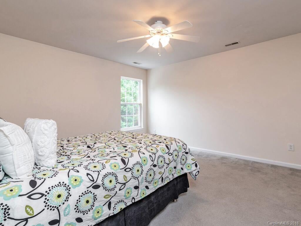253 Hyde Park Lane Fort Mill, SC 29708 - Photo 18 of 26 a bedroom with a bed and a window