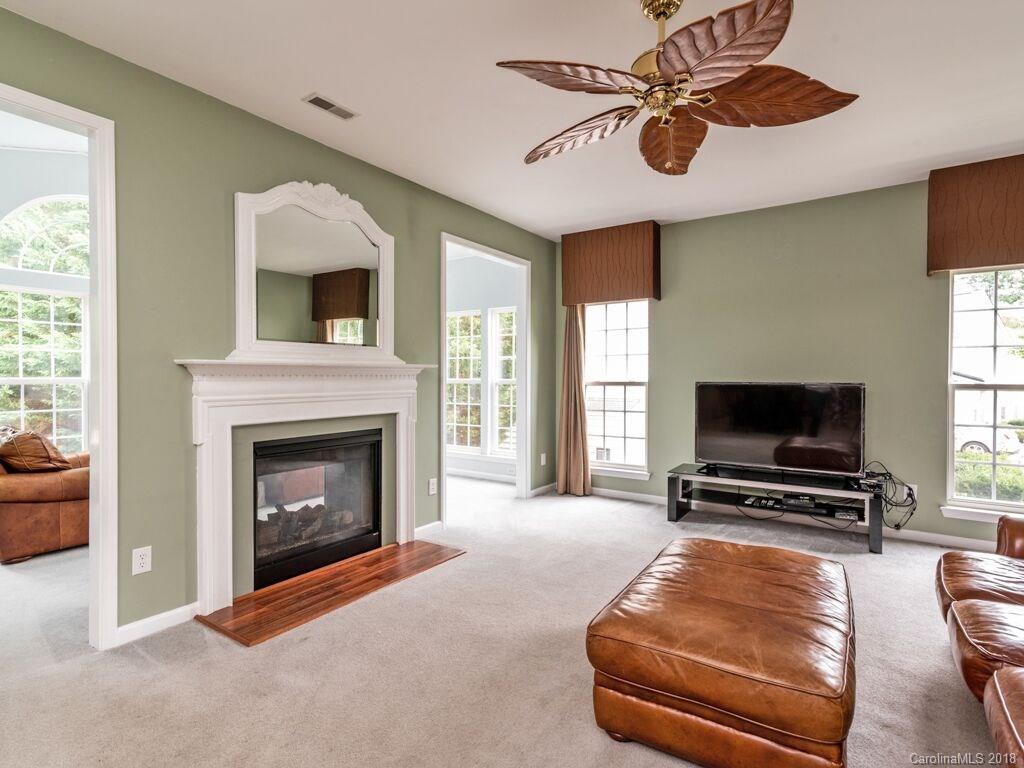 253 Hyde Park Lane Fort Mill, SC 29708 - Photo 4 of 26 a living room with furniture and a fireplace