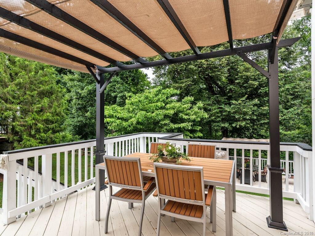 253 Hyde Park Lane Fort Mill, SC 29708 - Photo 5 of 26 a view of a chair and table on the deck