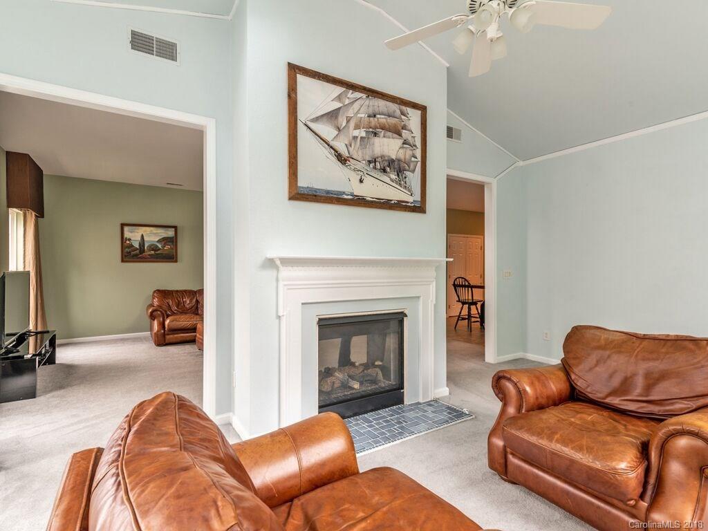 253 Hyde Park Lane Fort Mill, SC 29708 - Photo 7 of 26 a living room with furniture and a fireplace