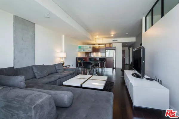 a living room with furniture and white walls