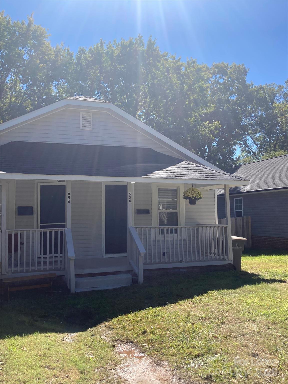 a view of a house with a yard covered in snow
