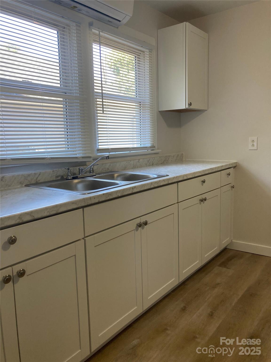 654 Wilson Street Kannapolis, NC 28083 - Photo 11 of 15 a kitchen with a sink and cabinets