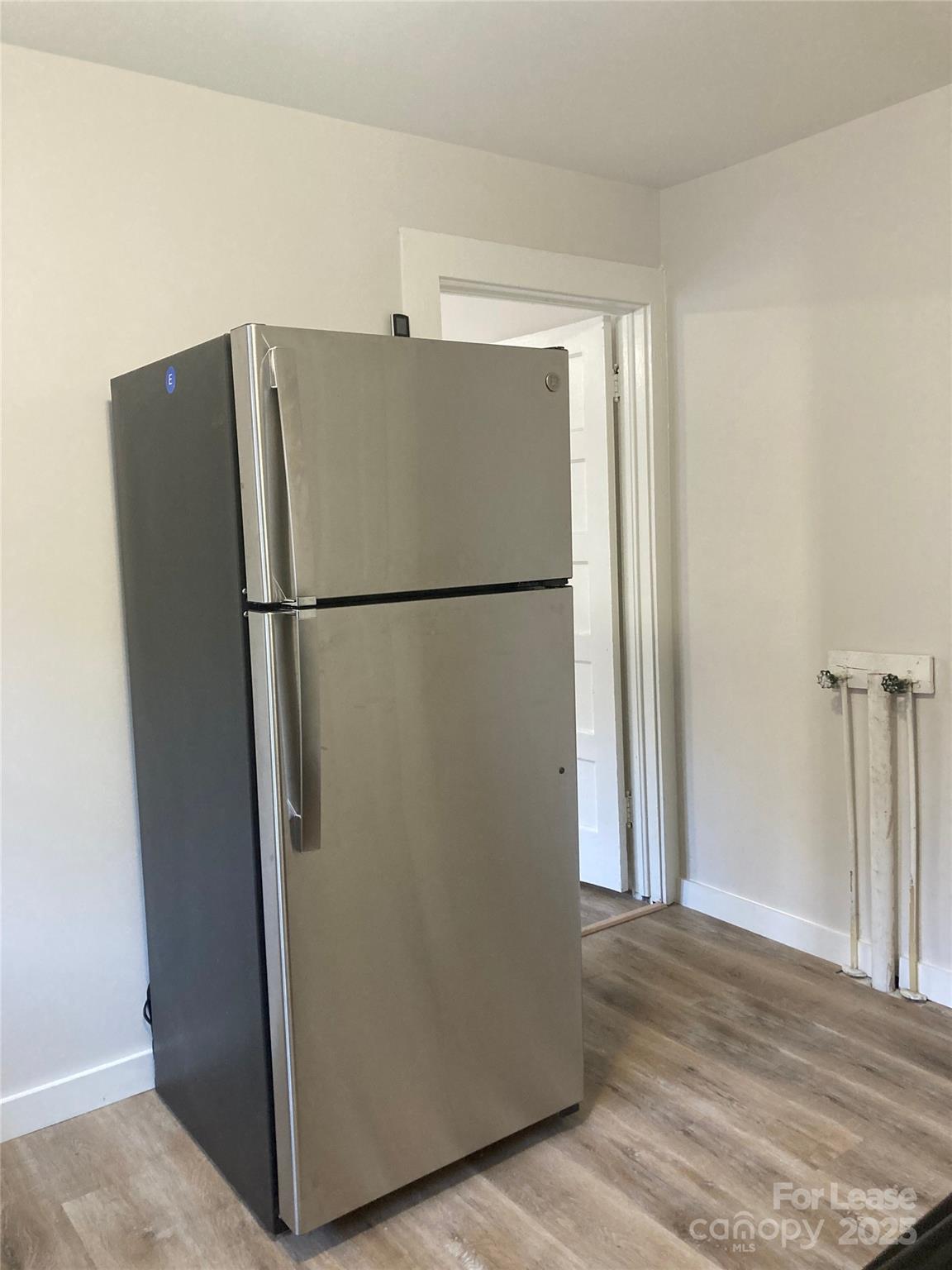 654 Wilson Street Kannapolis, NC 28083 - Photo 12 of 15 a white refrigerator freezer and a dishwasher in a kitchen