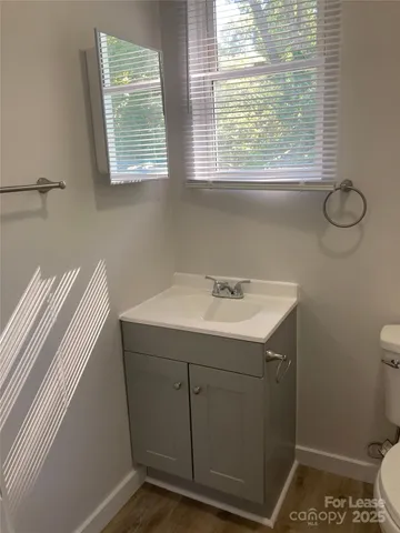 a bathroom with a shower and a toilet