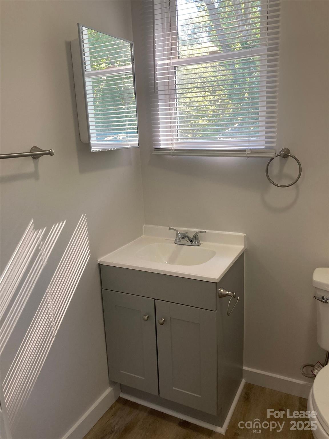 654 Wilson Street Kannapolis, NC 28083 - Photo 14 of 15 a bathroom with a sink and a vanity