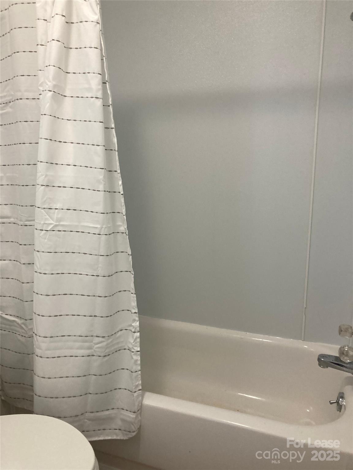 654 Wilson Street Kannapolis, NC 28083 - Photo 15 of 15 a bathroom with a shower and a toilet