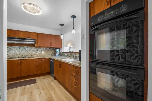 a kitchen with a refrigerator and a sink