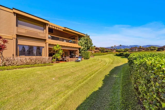 a swimming pool with outdoor seating and yard