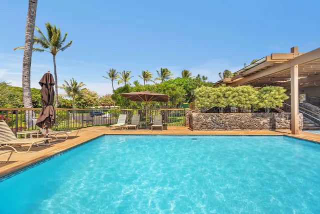 a view of a swimming pool with a lounge chair
