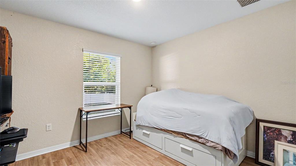 6201 East Peach Street Inverness, FL 34452 - Photo 21 of 30 a bedroom with a bed and a window