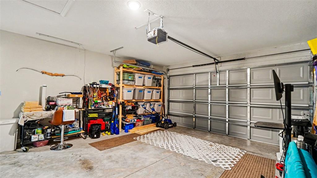 6201 East Peach Street Inverness, FL 34452 - Photo 24 of 30 a view of a garage with rack and bicycle