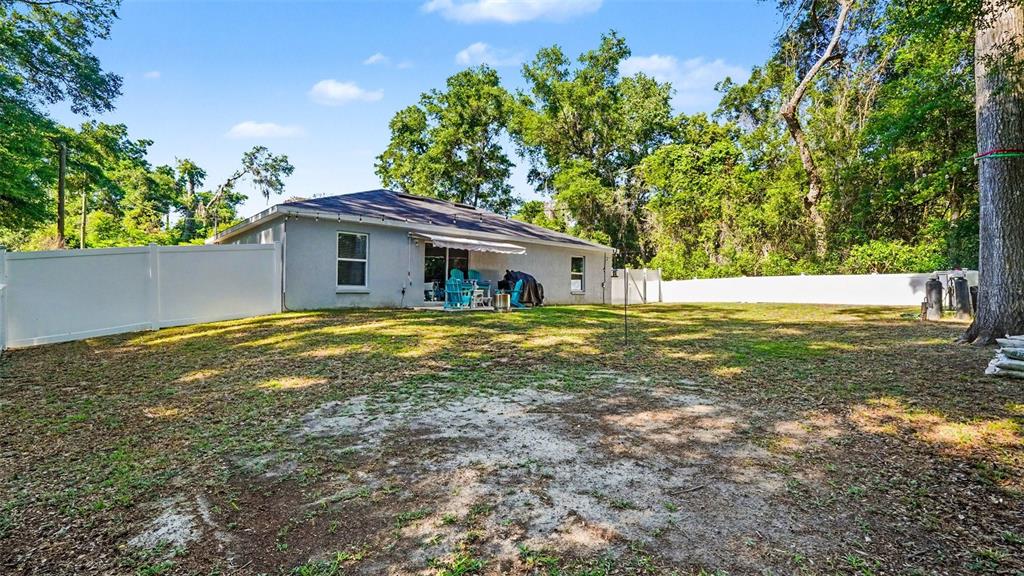 6201 East Peach Street Inverness, FL 34452 - Photo 30 of 30 a house with pool in front of it